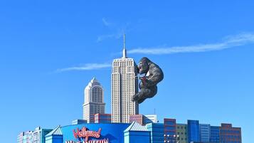 The Hollywood Wax Museum sign with a gorilla statue in front.