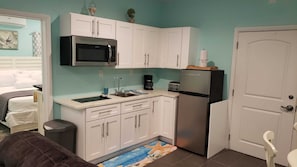 Fridge, microwave, stovetop, coffee/tea maker
