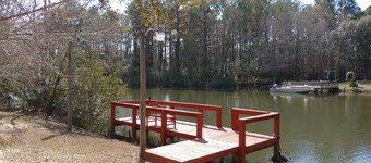 The Lake House at Turtle Cove: Cozy relaxing lake home with dock on wooded lot.