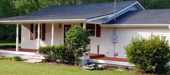The Lake House at Turtle Cove: Cozy relaxing lake home with dock on wooded lot.