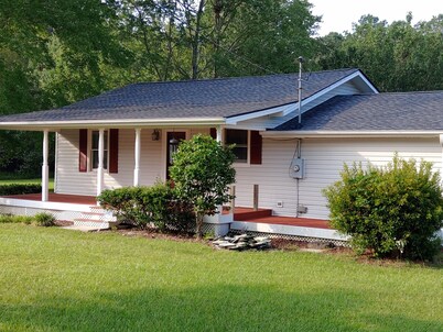 The Lake House at Turtle Cove: Cozy relaxing lake home with dock on wooded lot.