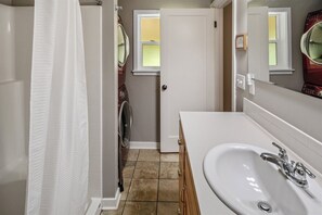Bathtub, hair dryer, towels