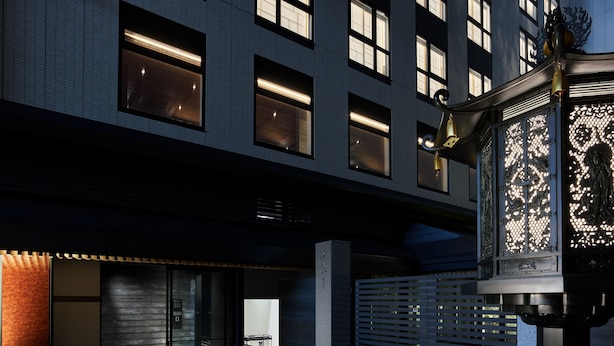 A modern building with large windows, a metal gate, and a traditional lantern. - Mitsui Garden Hotel Kyoto Kawaramachi Jokyoji (Kyoto)