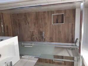 Shower, hair dryer, towels, toilet paper