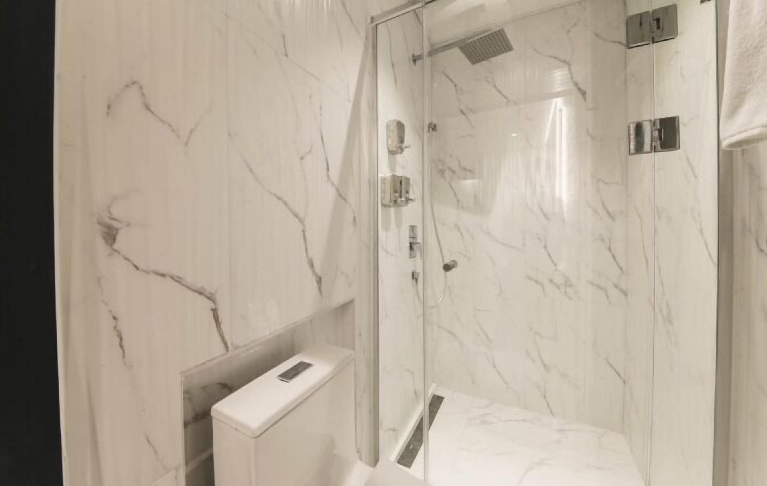 business double room | bathroom | shower, hair dryer, towels, soap