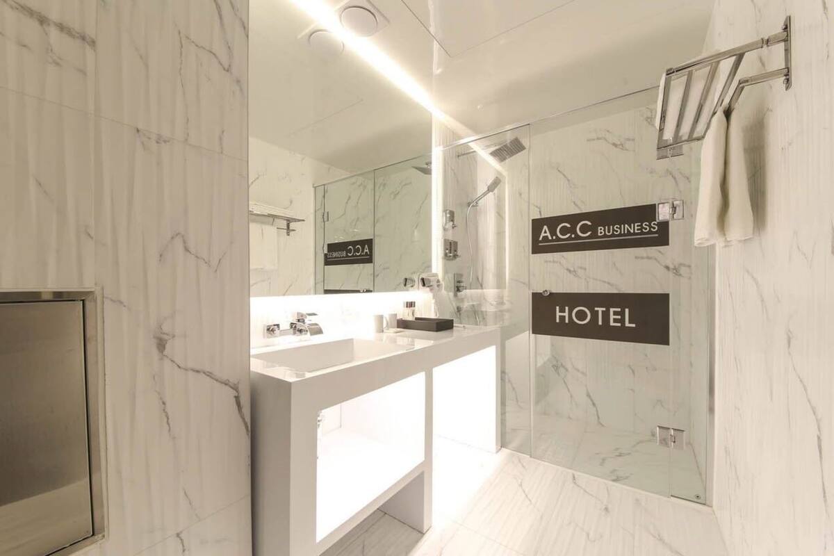 standard double room | bathroom | shower, hair dryer, towels, soap