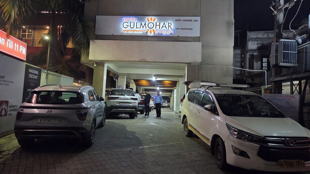 A hotel entrance with a sign for Hotel Gulmohar Grand. - Hotel Gulmohar Grand (East Jorhat)