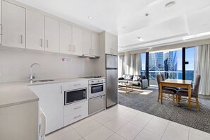 Apartment, 2 Bedrooms, Connecting Rooms | Private kitchen | Full-size fridge, microwave, oven, stovetop