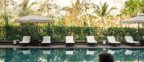 Outdoor pool, open 6:00 AM to 8:00 PM, sun loungers, lifeguards on site