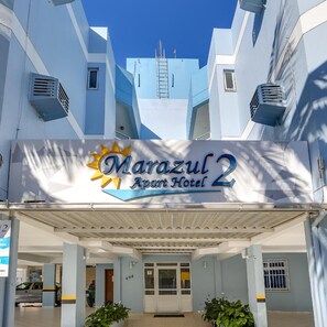 The Marazul 2 Apart Hotel entrance with a clear sky above. - Marazul Apart Hotel II (Florianopolis)
