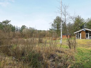 Escape to a serene cabin surrounded by lush greenery and natural beauty.