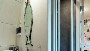 Shower, hair dryer, towels, toilet paper
