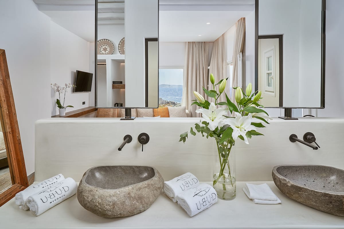 junior suite, sea view | bathroom | shower, designer toiletries, hair dryer, bathrobes