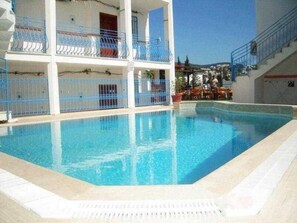 Seasonal outdoor pool, open 9:00 AM to 6:00 PM, pool umbrellas