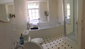 Bathtub, hair dryer, towels, soap
