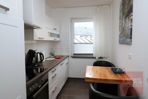 Aparthotel Kompass - Apartment (A204) | Private kitchen | Fridge, oven, stovetop, dishwasher
