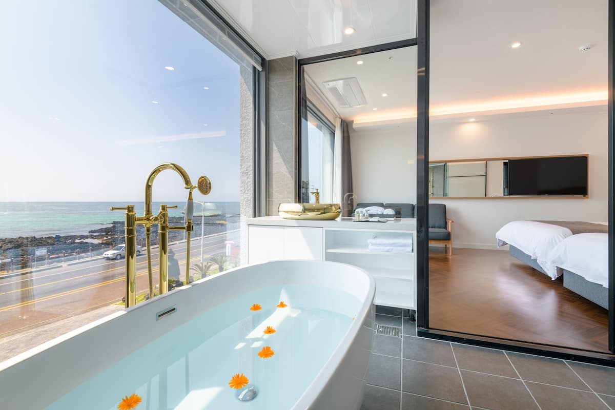 royal studio suite | bathroom | designer toiletries, hair dryer, slippers, bidet