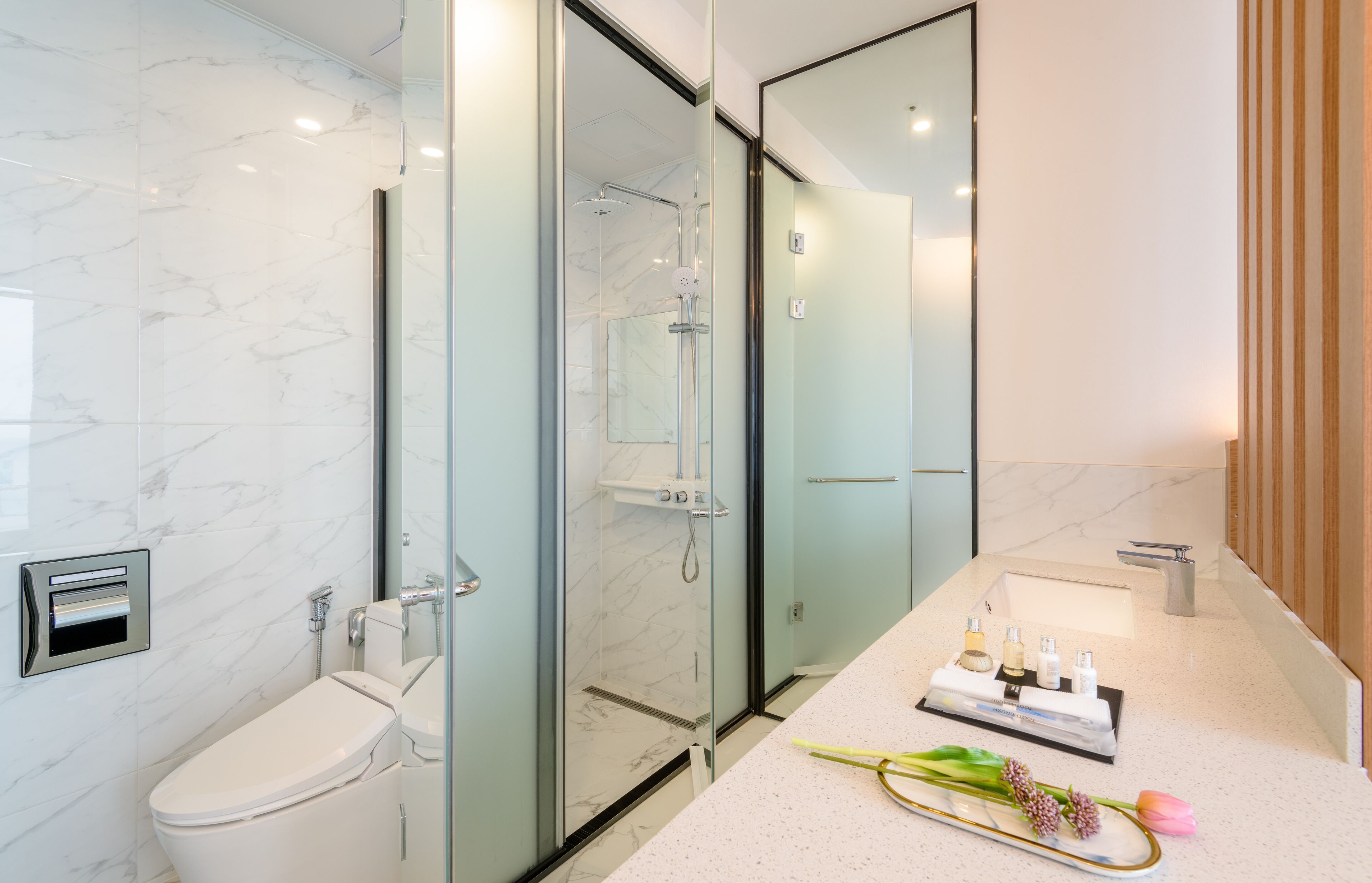 deluxe double room | bathroom | designer toiletries, hair dryer, slippers, bidet