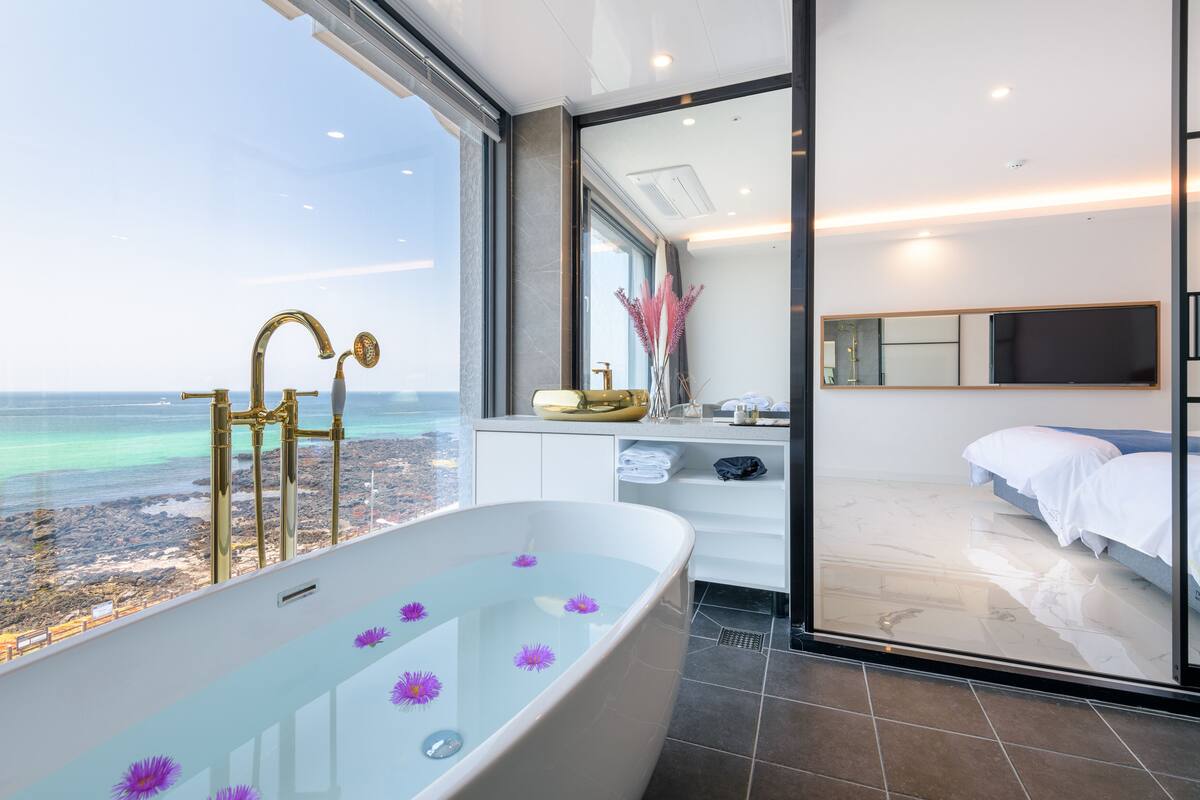 Family Studio Suite | Bathroom | Designer toiletries, hair dryer, slippers, bidet