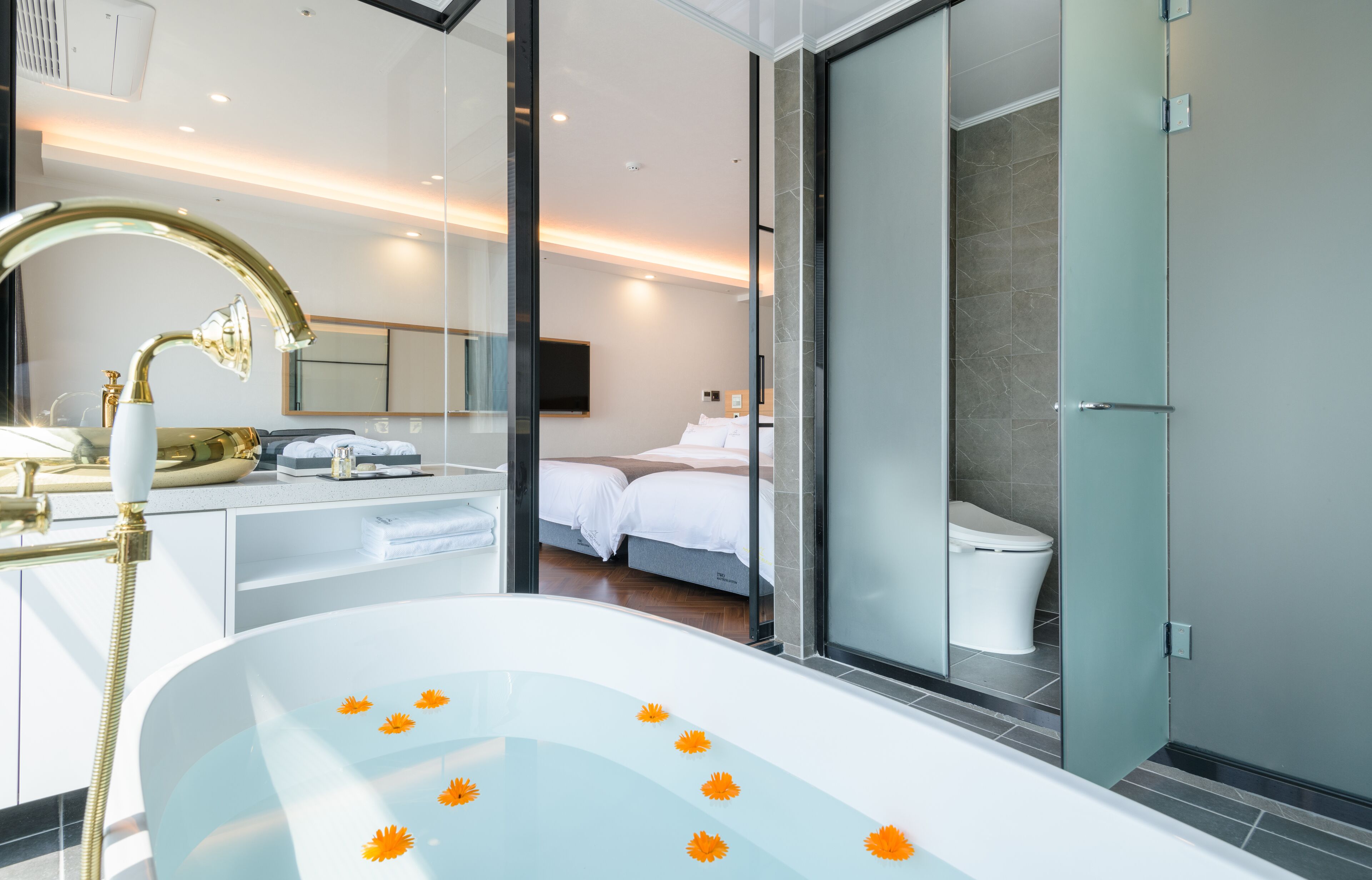 royal studio suite | bathroom | designer toiletries, hair dryer, slippers, bidet