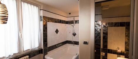 A bathroom with a bathtub, a sink, and a toilet.