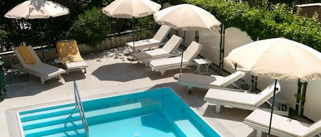 Seasonal outdoor pool, pool umbrellas, sun loungers