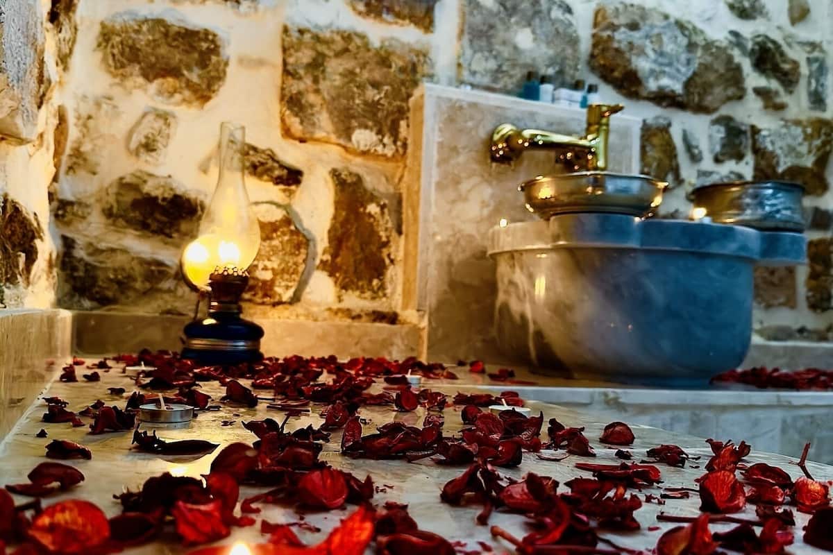 luxury room, 1 king bed, sauna | bathroom | rainfall showerhead, designer toiletries, hair dryer, slippers