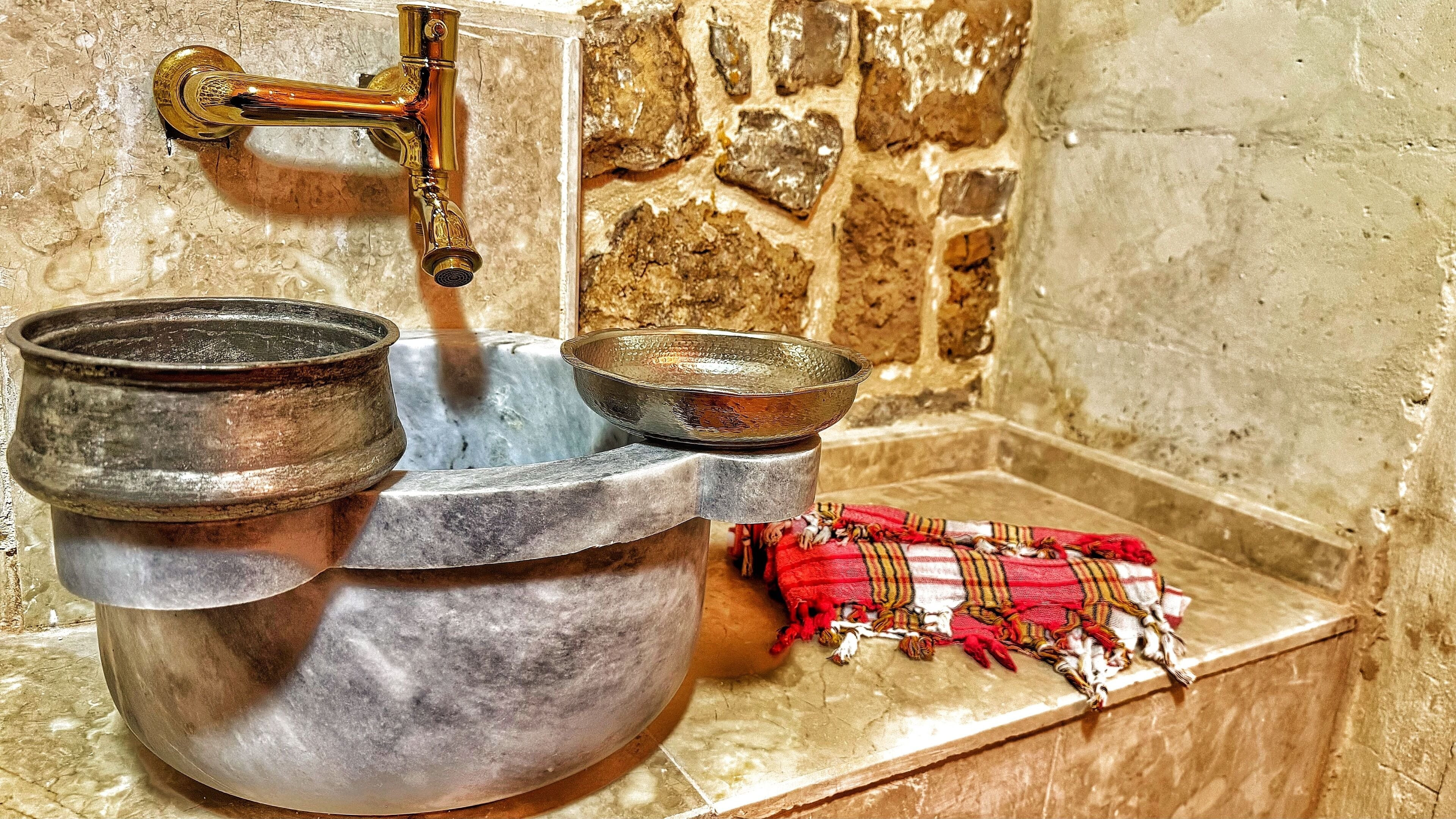 luxury room, 1 king bed, sauna | bathroom | rainfall showerhead, designer toiletries, hair dryer, slippers