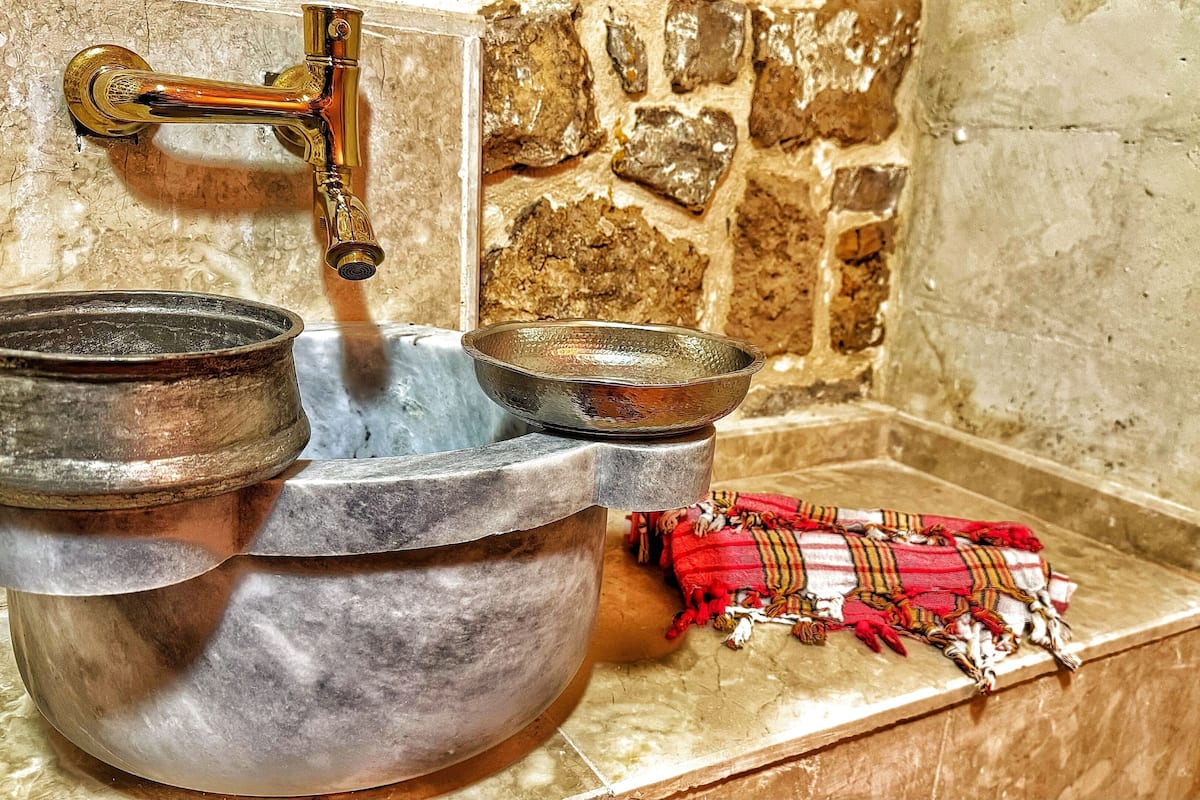 luxury room, 1 king bed, sauna | bathroom | rainfall showerhead, designer toiletries, hair dryer, slippers