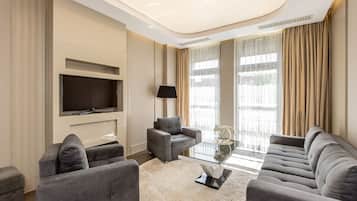 Design Apartment | Living area | 35-inch TV with cable channels