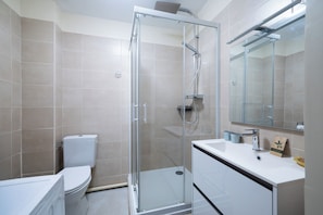 Shower, hair dryer, towels, soap