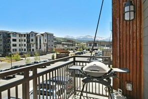 Enjoy al fresco dining on the balcony with a barbecue grill and city views.
