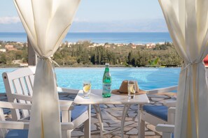 Outdoor pool, a heated pool - Villa Regina Rossa is a large villa with stunning sea views and a heated pool (Corfu)