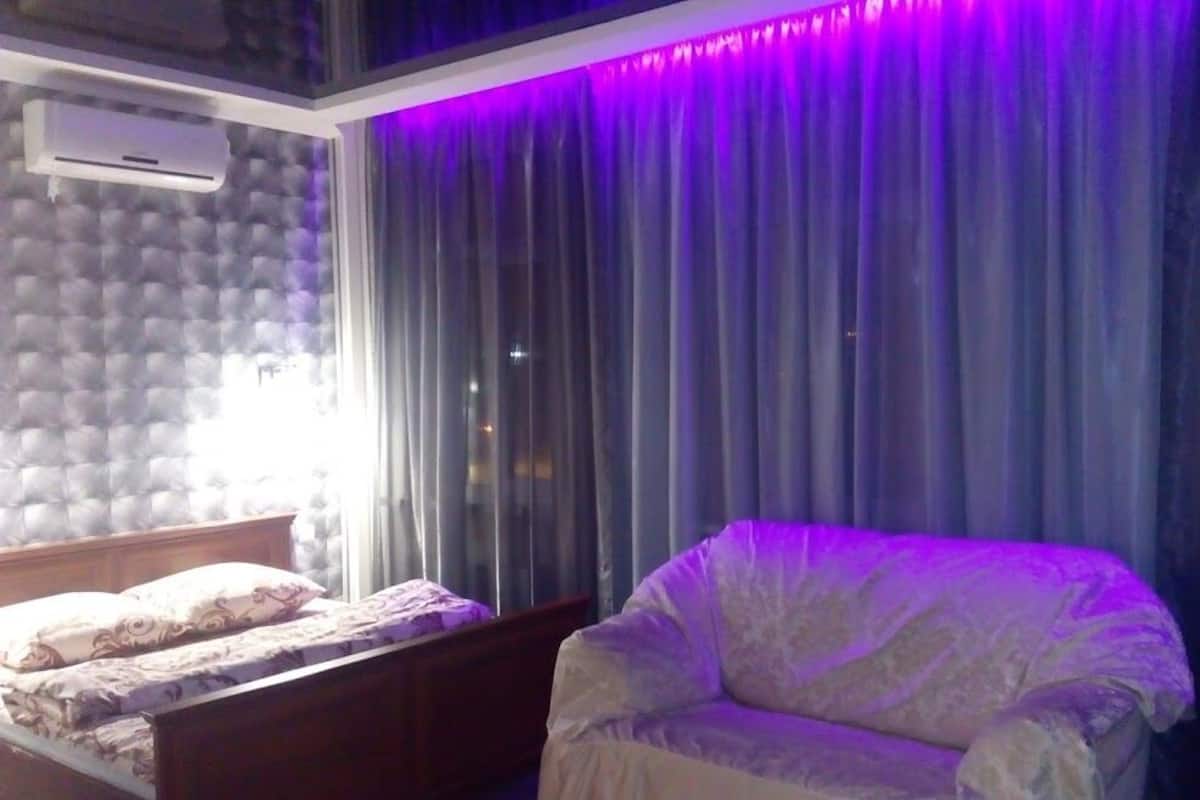 Desk, laptop workspace, blackout curtains, iron/ironing board