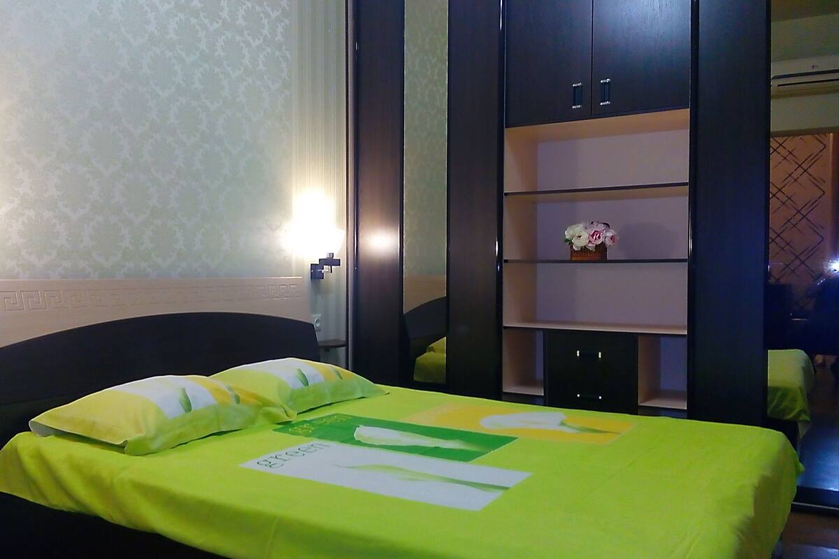Desk, laptop workspace, blackout curtains, iron/ironing board