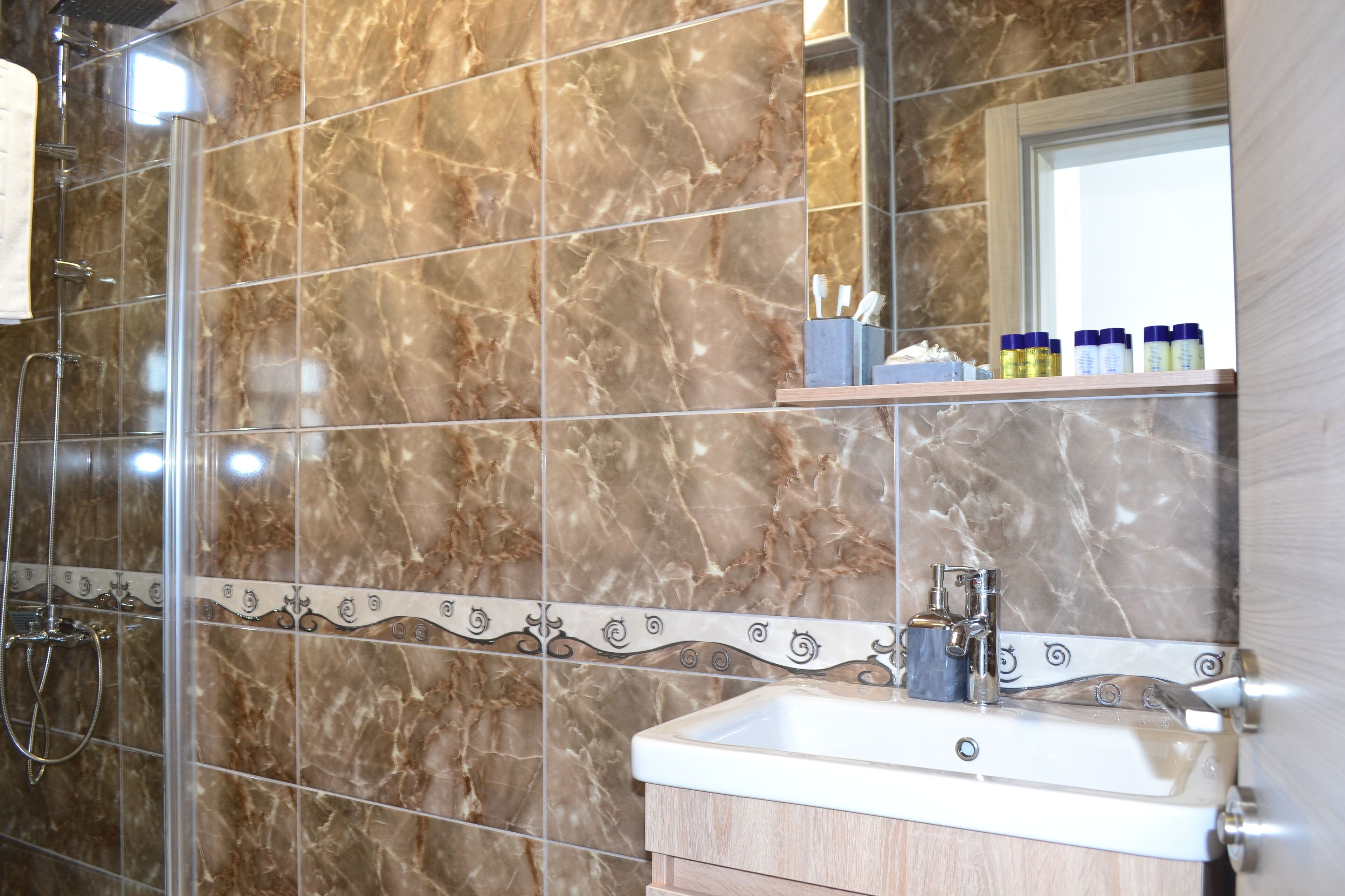 junior double room, courtyard view | bathroom | shower, free toiletries, hair dryer, slippers