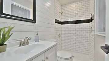 Combined shower/tub, hair dryer, towels, soap