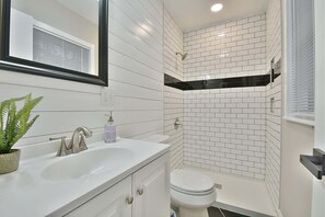 Combined shower/tub, hair dryer, towels, soap