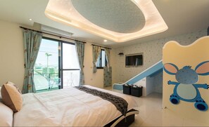 A bedroom with a bed, a window with curtains, a staircase, and a wall with a cartoon character. - Sugar Baby B&B (Wujie)