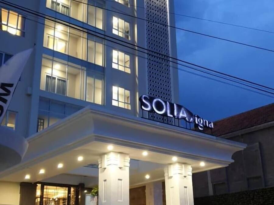 A hotel entrance with a sign reading "SOLIA".