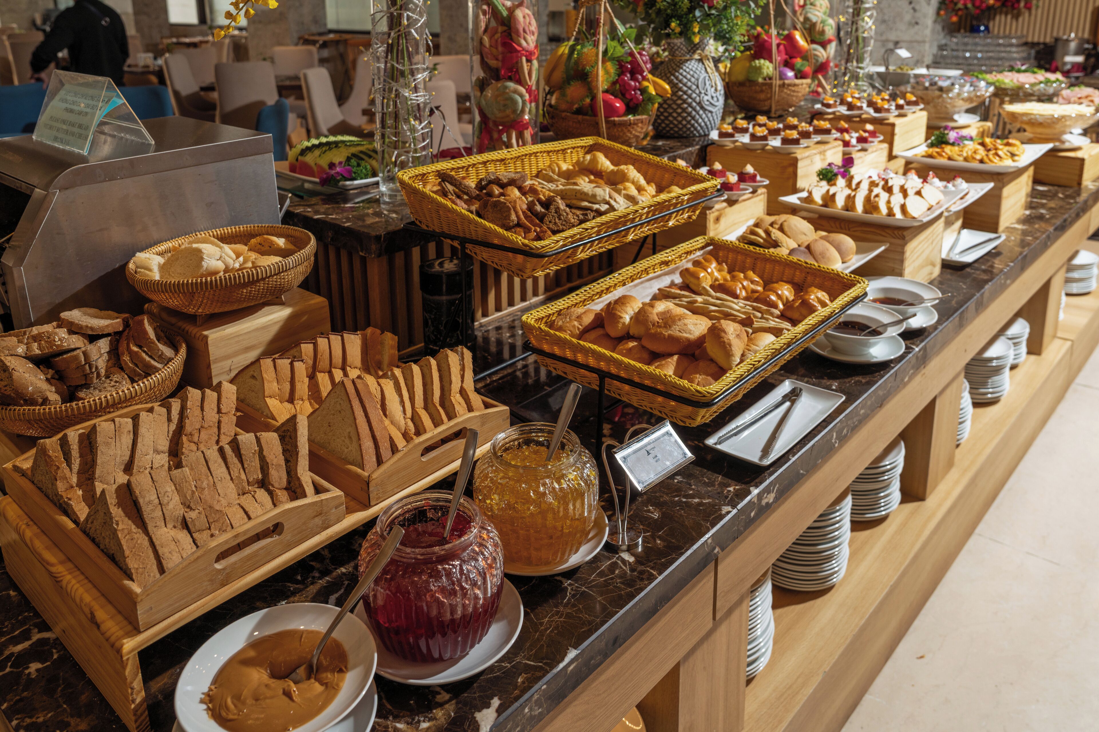 A buffet with various food items and condiments.
