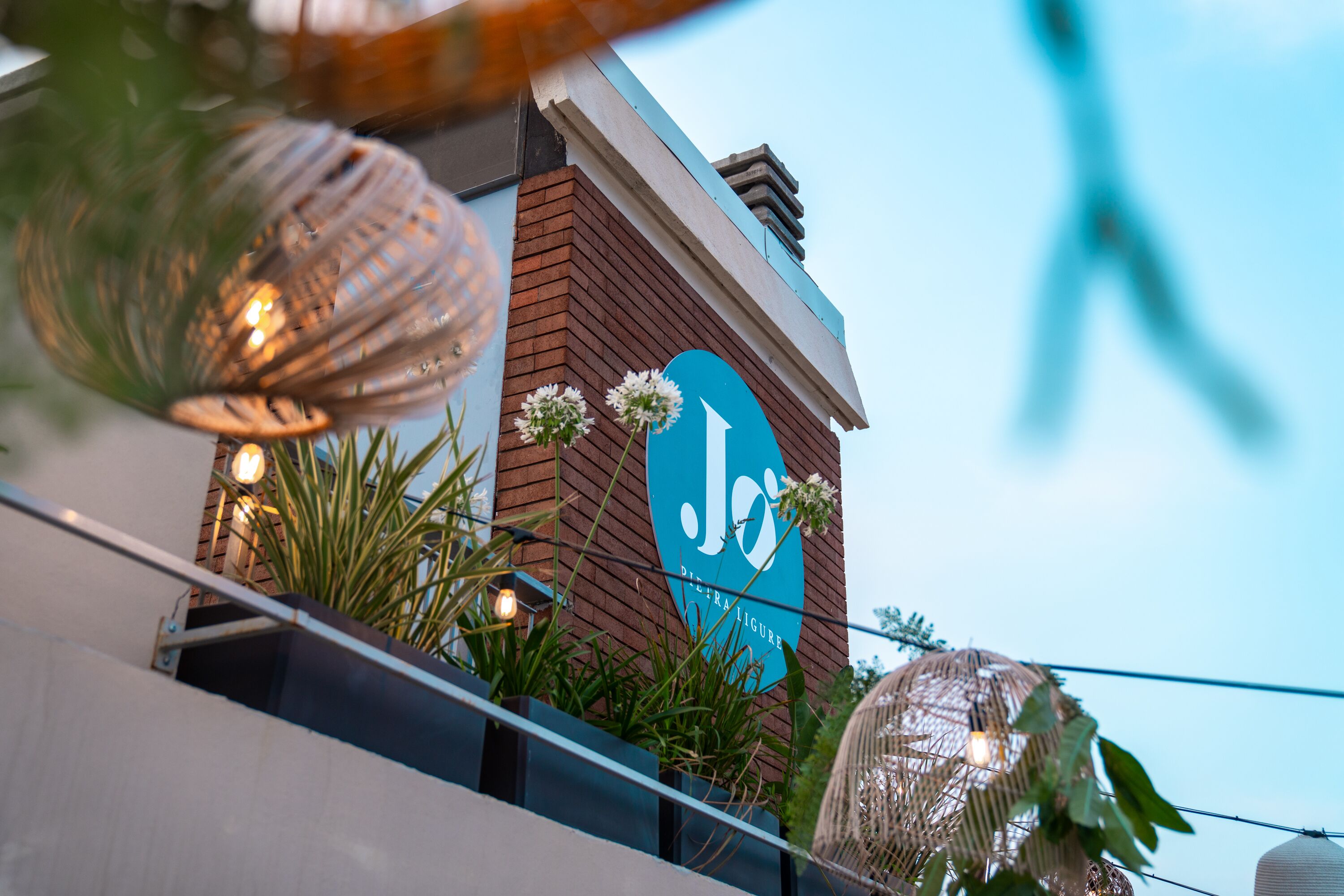A building with a prominent sign that reads "Jo's Bistro".
