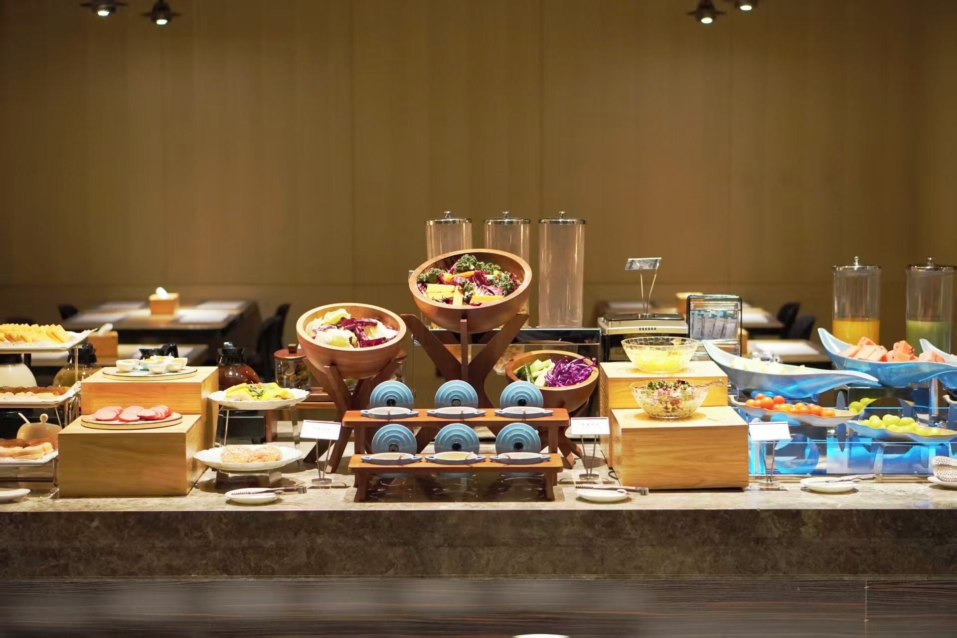 A buffet setup with various food items and serving dishes.