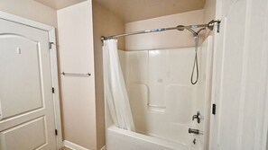 Combined shower/bathtub, hair dryer, shampoo, toilet paper