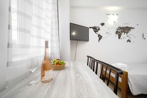 Comfort Apartment, 1 Bedroom | Living area | 32-inch flat-screen TV with digital channels, TV