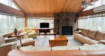 Lodge-style multi-level home at the Homestead in Glen Arbor. Deck with grill.