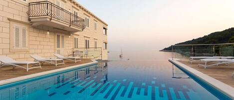 A heated pool, pool loungers