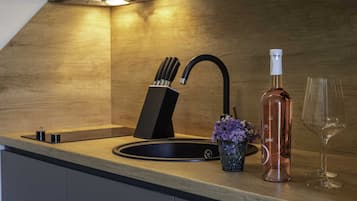 Fridge, stovetop, cookware/dishes/utensils, dining tables