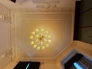 A ceiling with an ornate chandelier and decorative moldings. - Respect for the old but a reverence for a modern living ♥ (Wien)