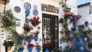 A storefront with a sign reading "Tasca Patio de las Comedias."